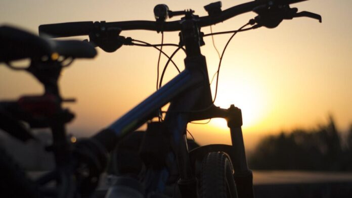 Silhouette of a bike against the sky